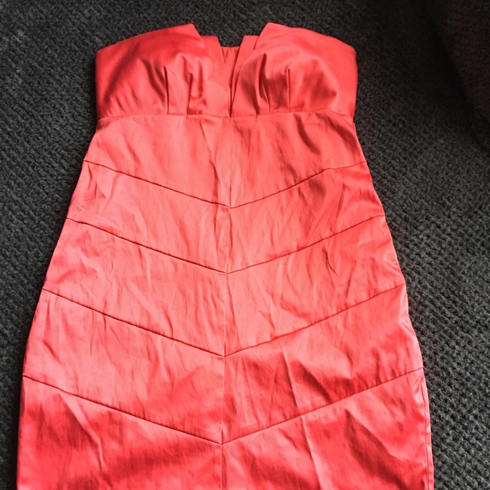 TAKING TO GOODWILL Salmon colored strapless dress.